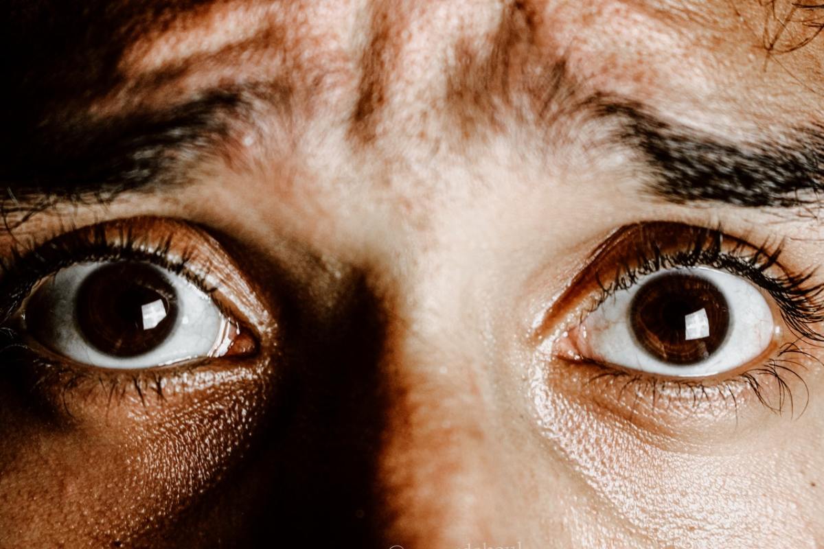 Close up of a person's eyes looking afraid
